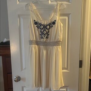 Elegant Cream Dress with Blue Embroidery